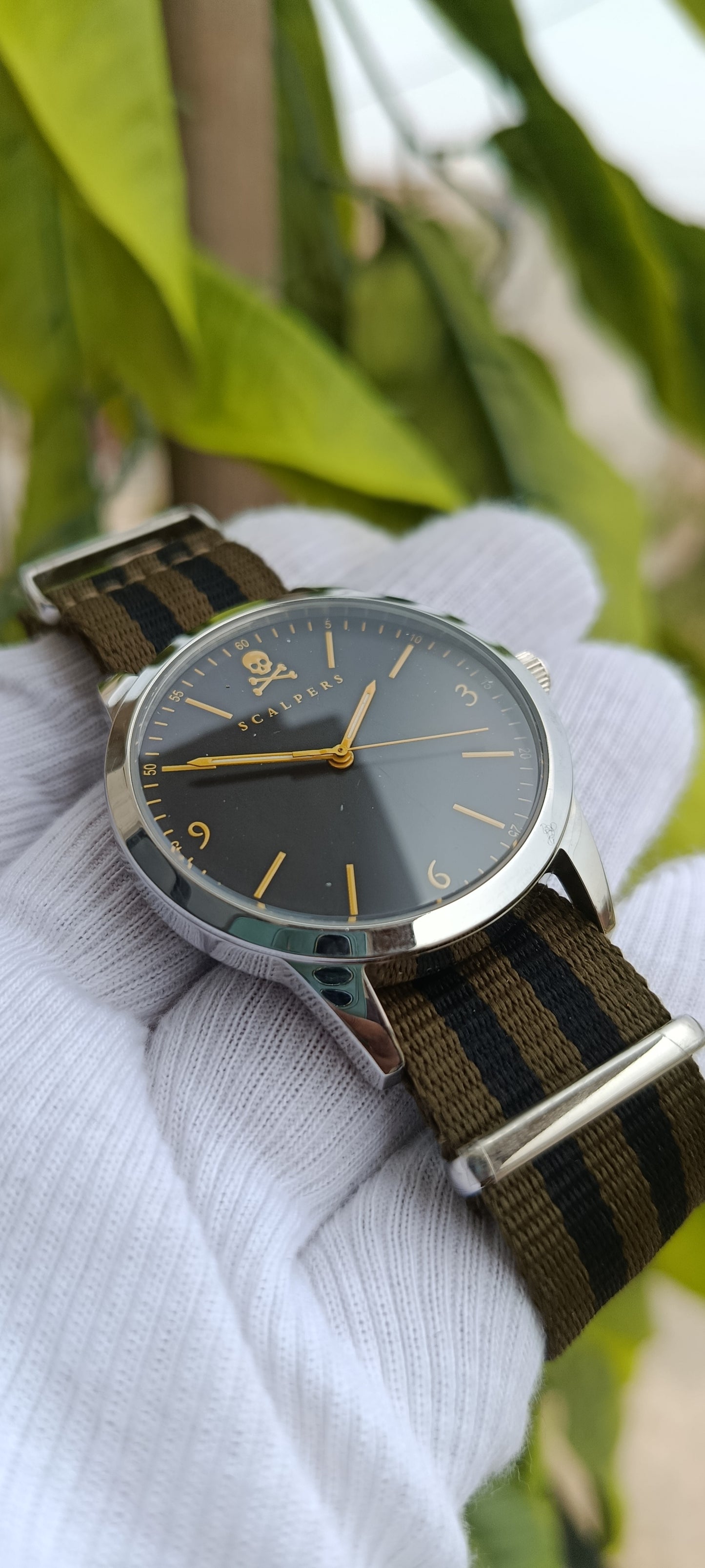 Scalpers Skull Logo Men's Watch – Black Dial with Yellow Accents, Olive & Black Striped NATO Strap