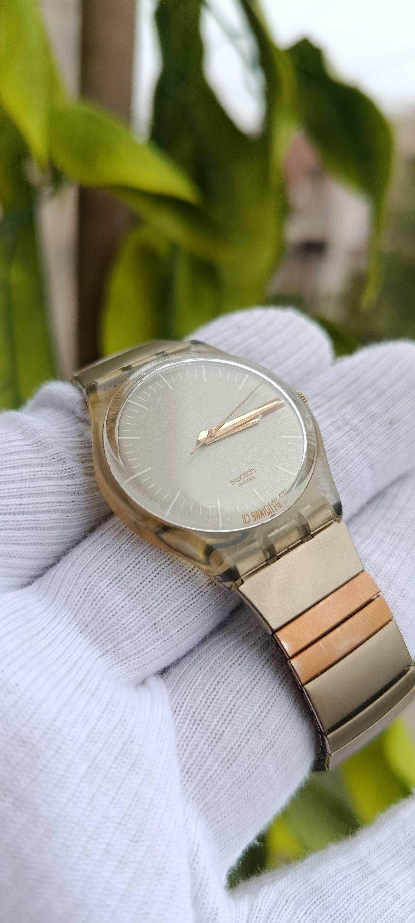 Swatch Swiss AG 2000 Minimalist Watch, Transparent Case, Metal Bracelet