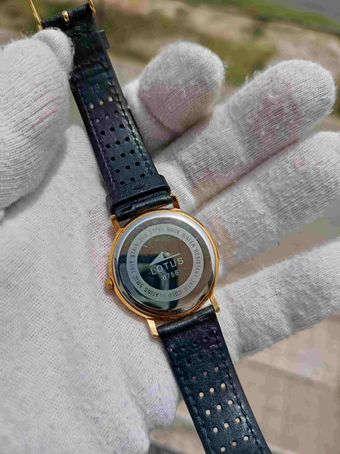 Lotus Quartz Men's Watch | White Dial | Gold-Tone Case | Black Perforated Leather Strap | Date Display | Classic Dress Watch