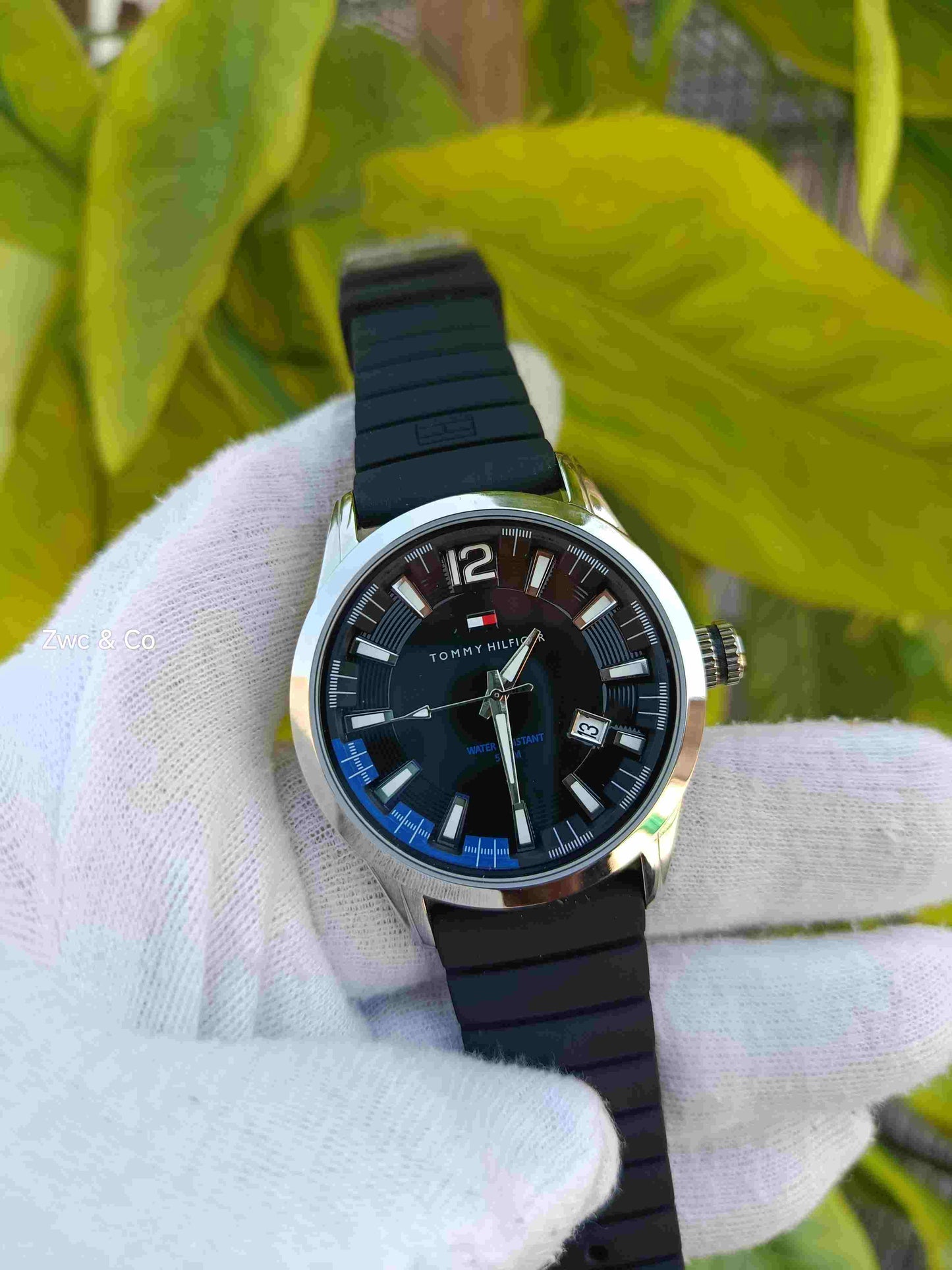 Tommy Hilfiger Sport Quartz Black Dial Blue Accent Inner Bezel Silver-Tone Case Black Rubber Silicone Strap Men's Water Resistant Watch with Date Display