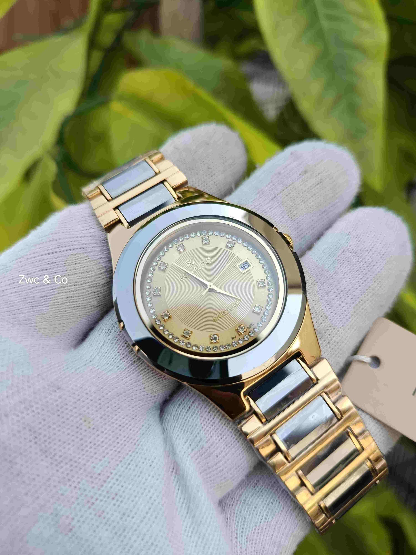 Rovaldo RV-9002 Sapphire Watch – Champagne Gold Dial, Full Crystal Ring, Rose Gold & White Ceramic Two-Tone Bracelet, Date Display