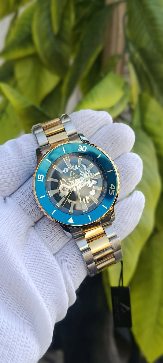 Fitron Skeleton Dial Diver-Style Watch – Teal Bezel & Two-Tone Bracelet