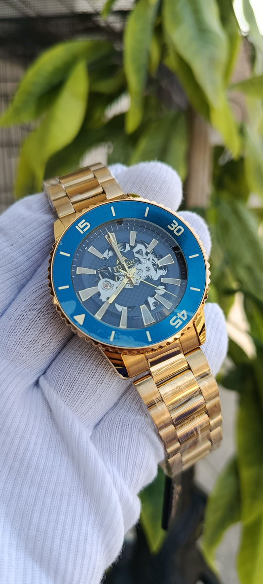 Fitron Gold-Tone Skeleton Dial Watch with Blue Bezel