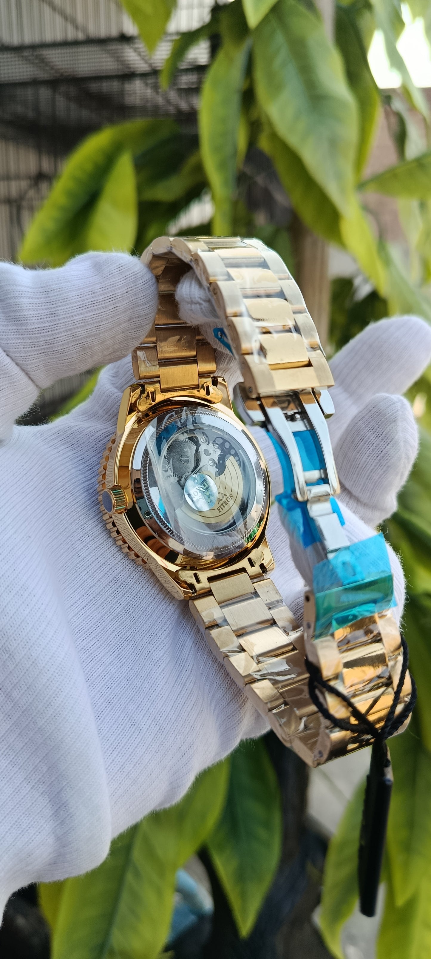 Fitron Gold-Tone Skeleton Dial Watch with Blue Bezel