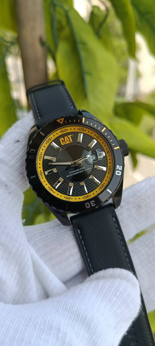 CAT (Caterpillar) Diver-Style Watch | Black Textured Dial | Yellow Accent Bezel & Ring | Date Window | Stainless Steel Case | Water Resistant 100m/10 ATM | Black Leather Strap | Ref. YR.141.11.626