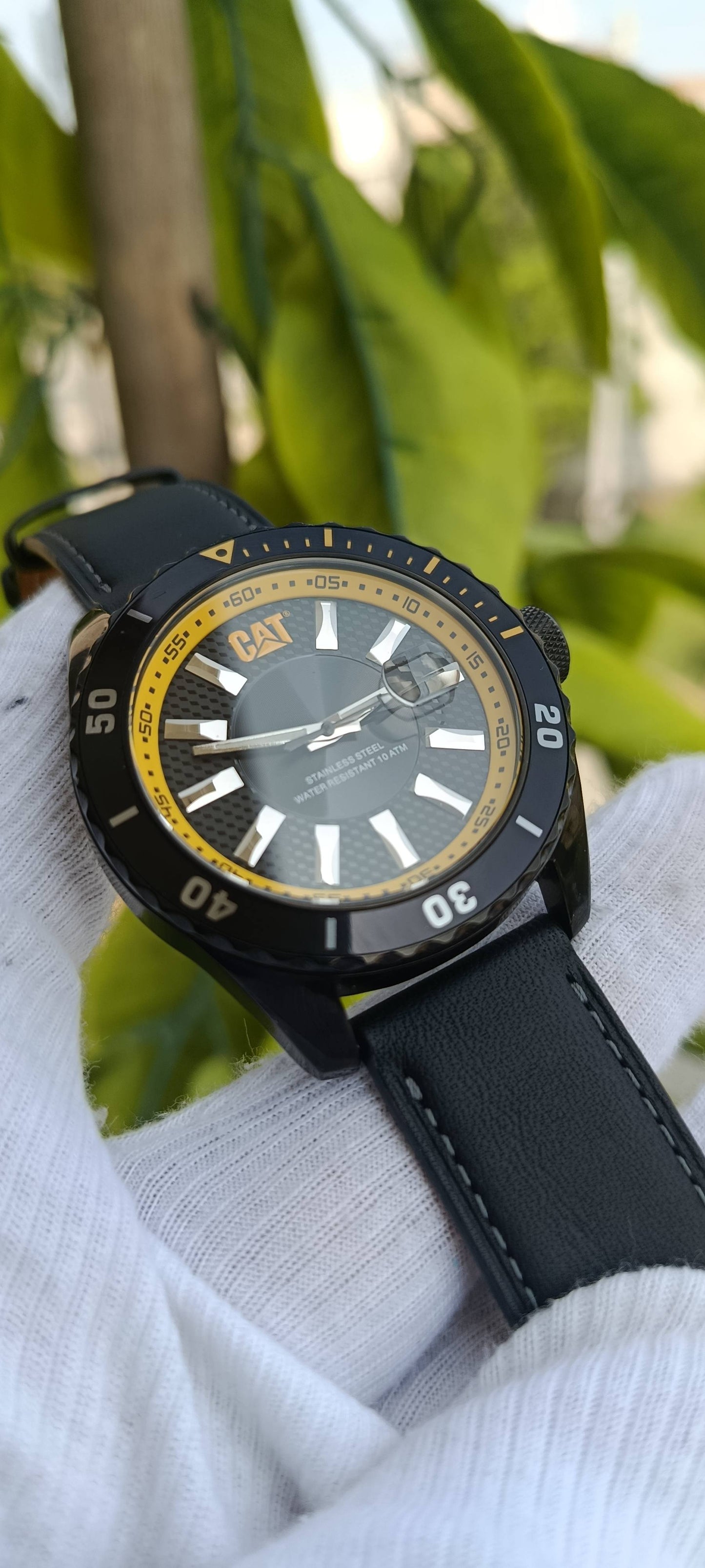 CAT (Caterpillar) Diver-Style Watch | Black Textured Dial | Yellow Accent Bezel & Ring | Date Window | Stainless Steel Case | Water Resistant 100m/10 ATM | Black Leather Strap | Ref. YR.141.11.626