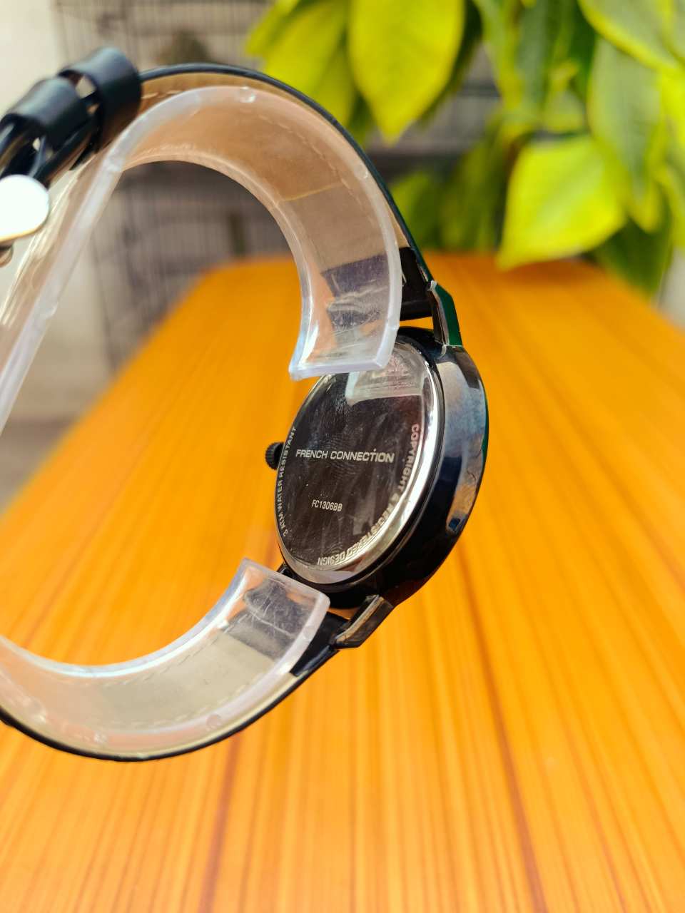 French Connection FC1306BB men's analogue quartz watch with a black dial and a black leather strap.